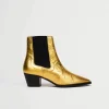 Goldene vegane Lederstiefel