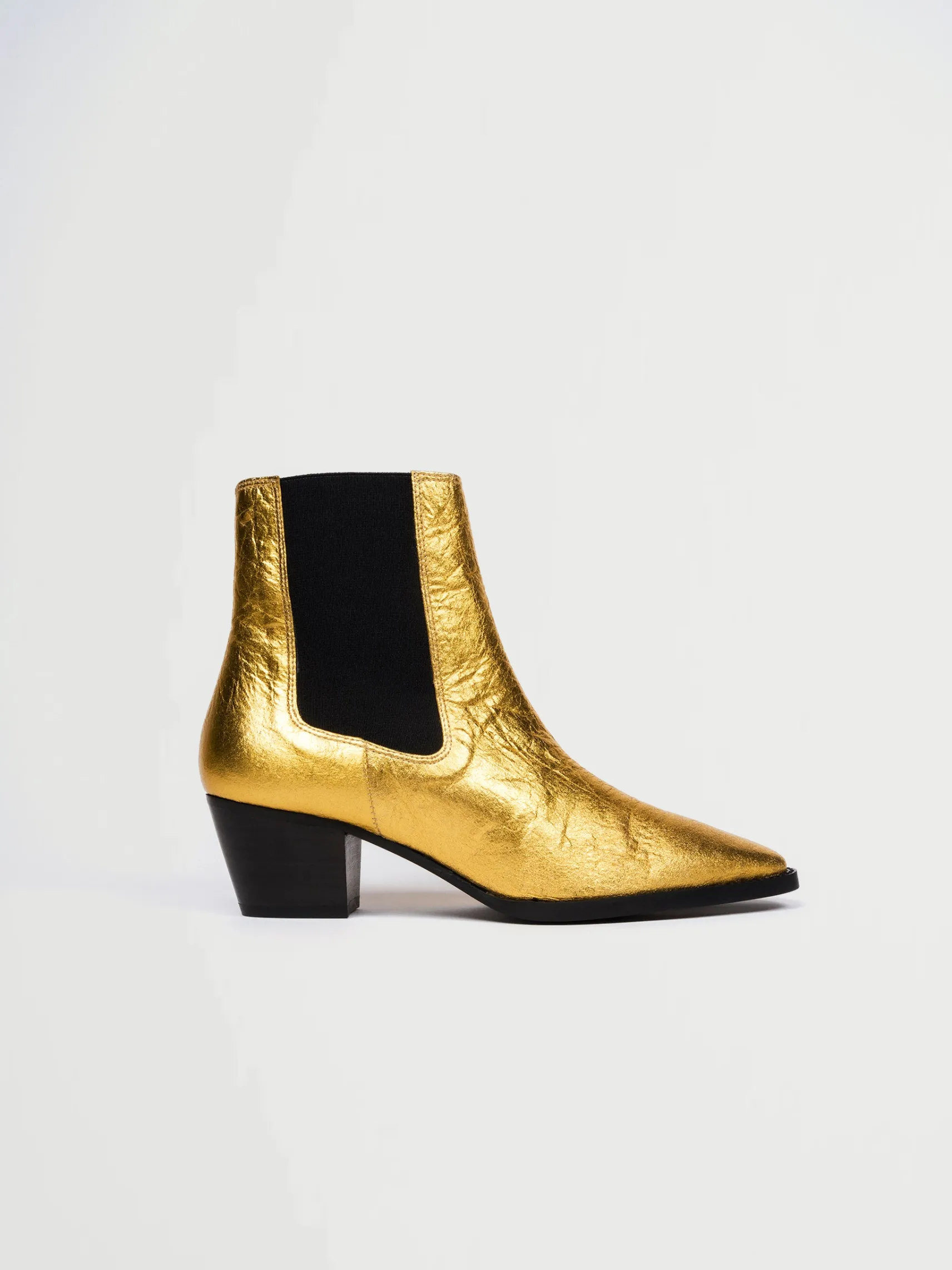 goldene_vegane_lederstief_0.webp Goldene vegane Lederstiefel
