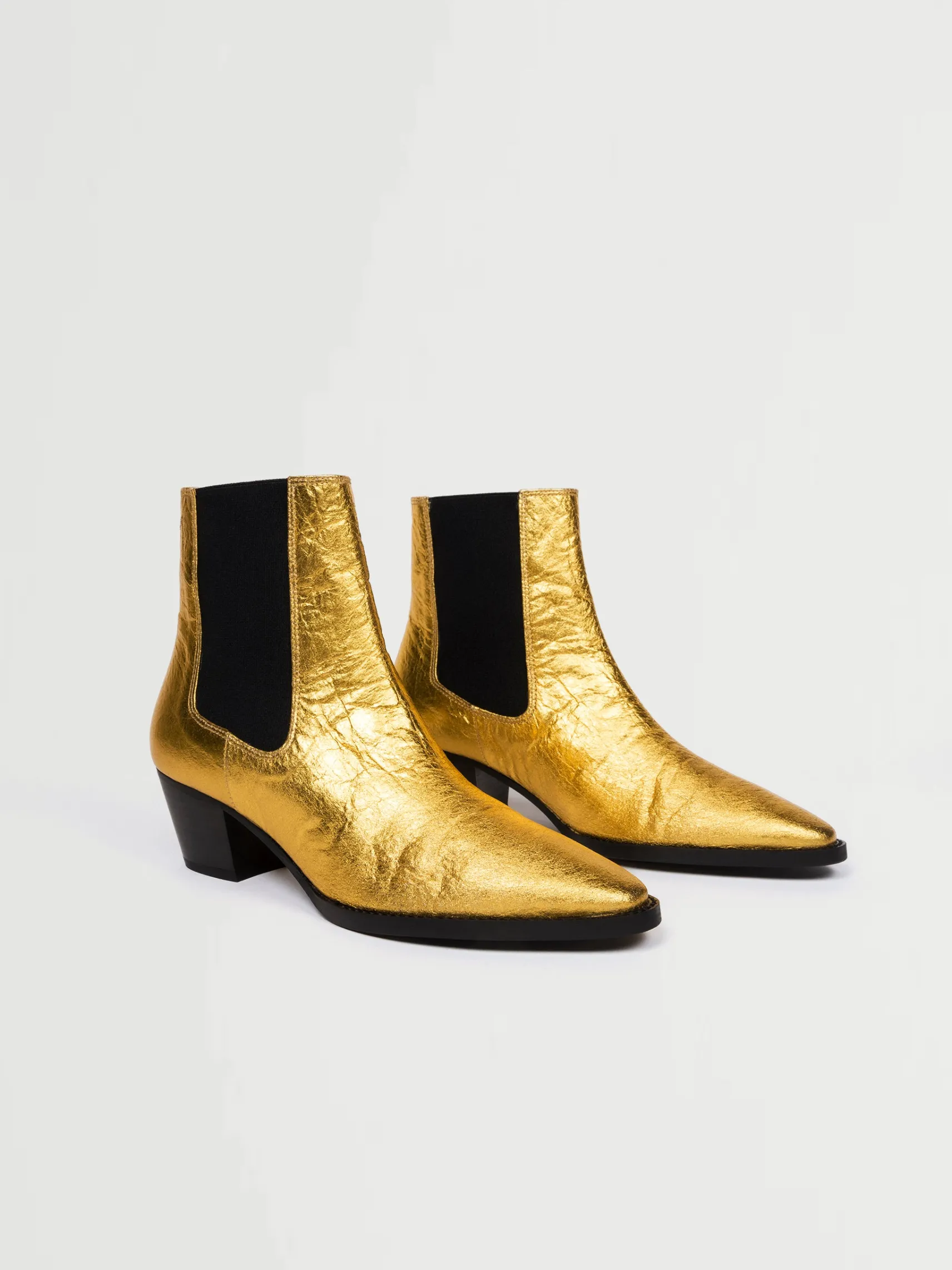 goldene_vegane_lederstief_1.webp Goldene vegane Lederstiefel